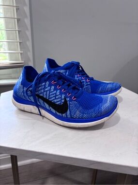 Nike Women's Free 4.0 Flyknit Running Shoes in the Racer Blue/Hyper Orange/Black
